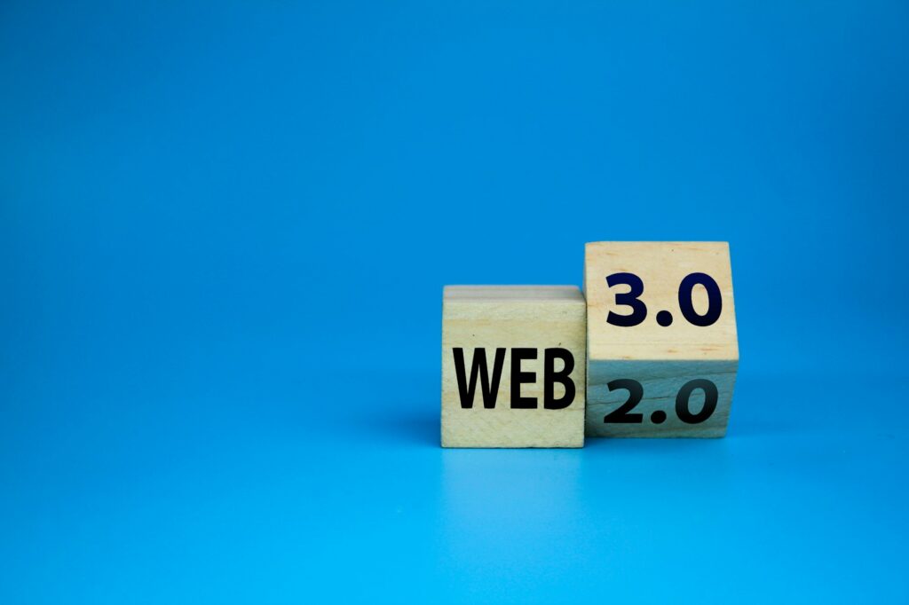 wooden cube with the words web 3.0 or 2.0.